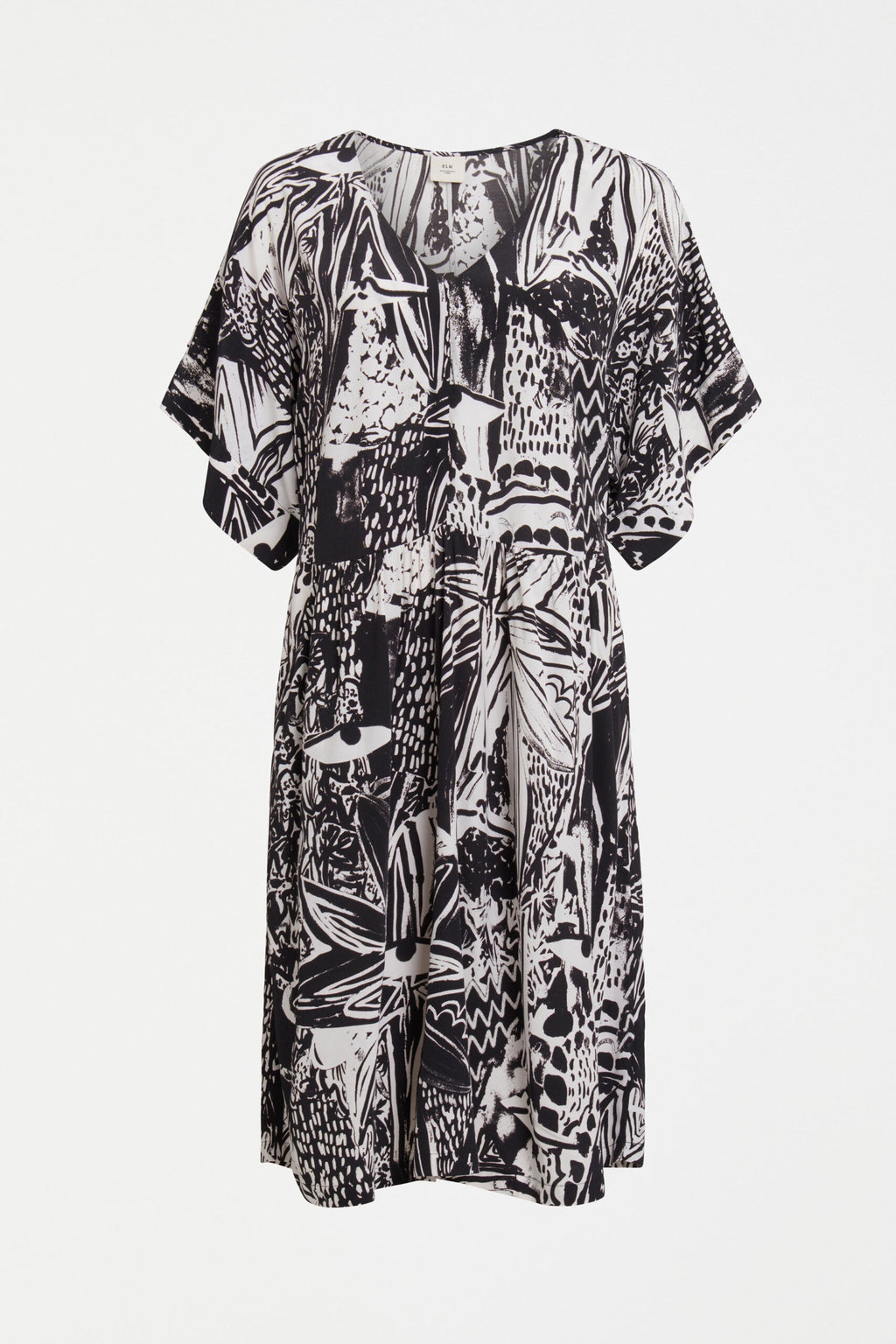 The Lento Dress in Tropea Print - an expressive monochrome piece featuring batwing sleeves and a centre seam down the front and back.