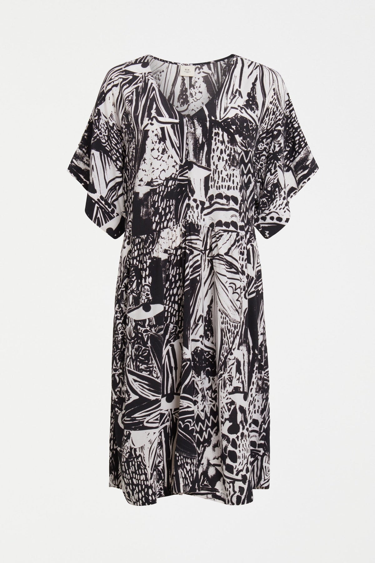 The Lento Dress in Tropea Print - an expressive monochrome piece featuring batwing sleeves and a centre seam down the front and back.