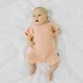 Charlie Pink Knit Romper in pink has a stud opening for easy dressing.