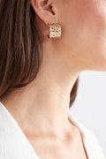 Hulle Tiny Hoop Earring in Gold - textured with unique punched holes