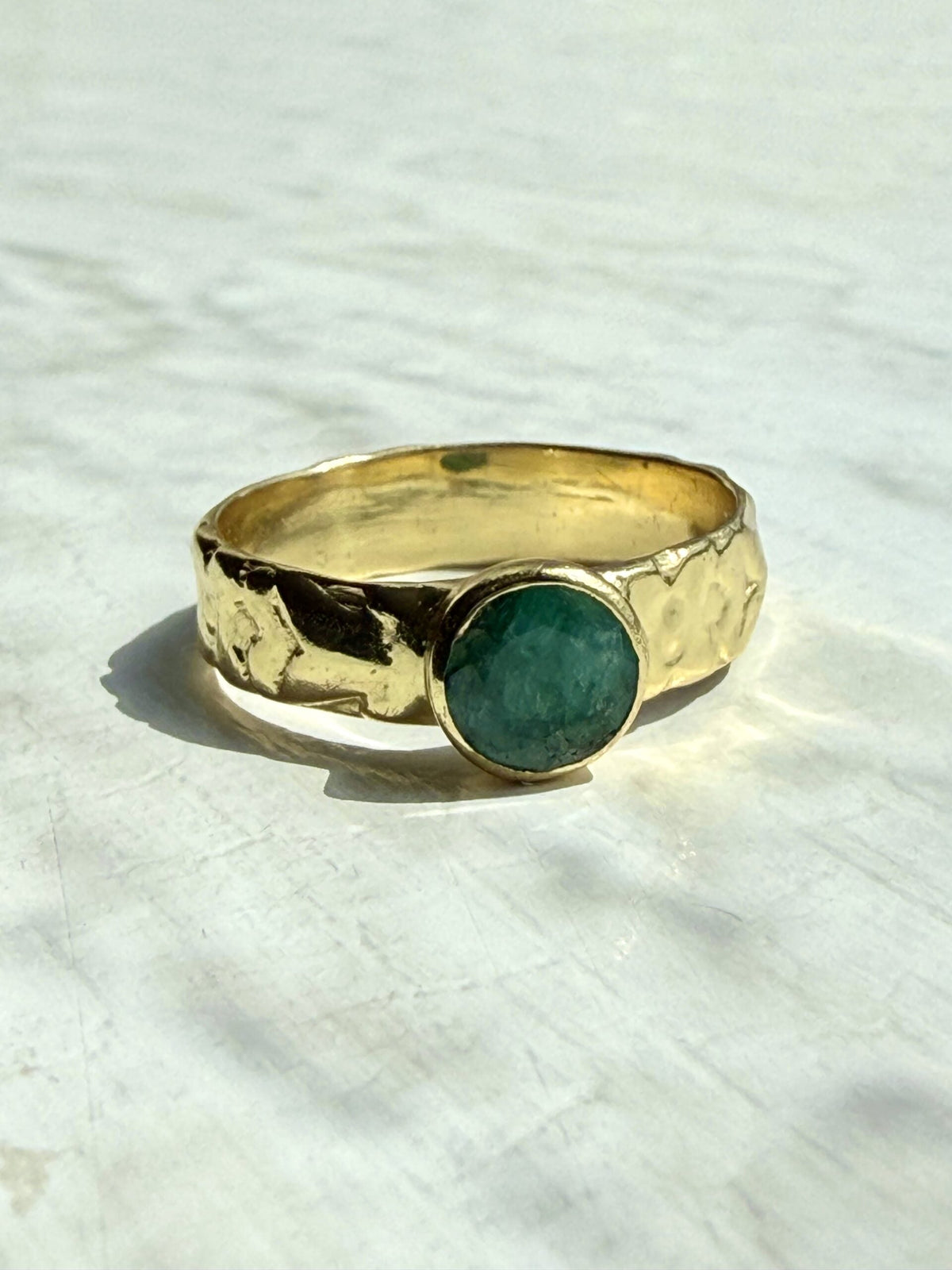 Green Corundum Ring featuring semi‑precious stone set in gold‑plated brass band.