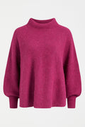 Palmen Poncho featuring batwing sleeves and mock turtleneck - available in hot pink and peacock colours