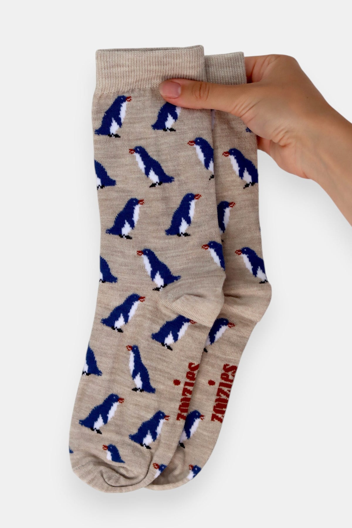 Zoozies Penguin Beige Merino Socks featuring a Blue Penguin design inspired by Oamaru, made in New Zealand